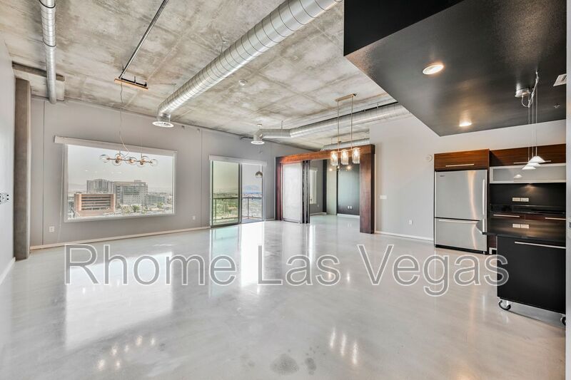 Modern Industrial Loft at Soho Lofts – 1BR/2BA High-Rise in the Arts District, City & Mountain Views! property image