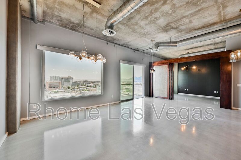 Modern Industrial Loft at Soho Lofts – 1BR/2BA High-Rise in the Arts District, City & Mountain Views! property image