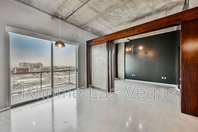 Modern Industrial Loft at Soho Lofts – 1BR/2BA High-Rise in the Arts District, City & Mountain Views! property image
