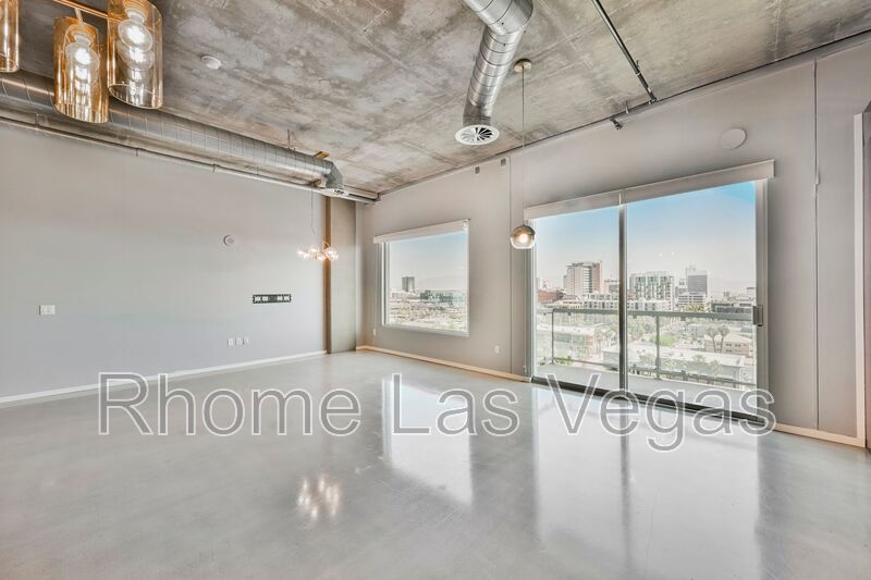 Modern Industrial Loft at Soho Lofts – 1BR/2BA High-Rise in the Arts District, City & Mountain Views! property image