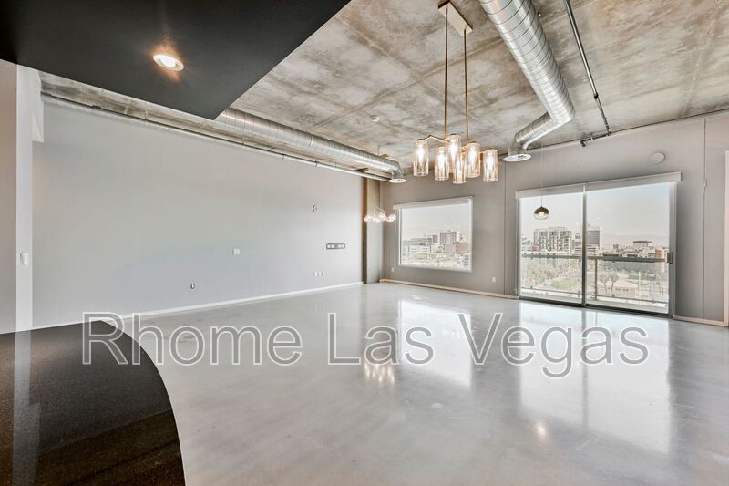 Modern Industrial Loft at Soho Lofts – 1BR/2BA High-Rise in the Arts District, City & Mountain Views! property image