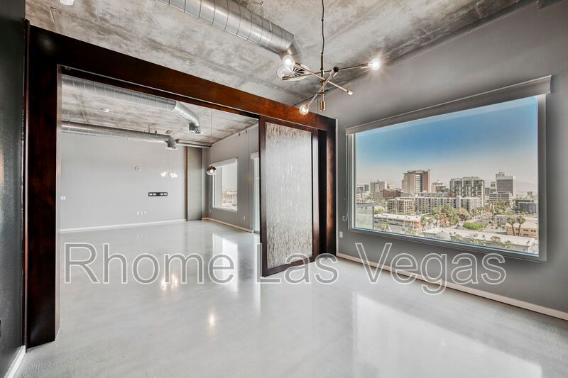 Modern Industrial Loft at Soho Lofts – 1BR/2BA High-Rise in the Arts District, City & Mountain Views! property image