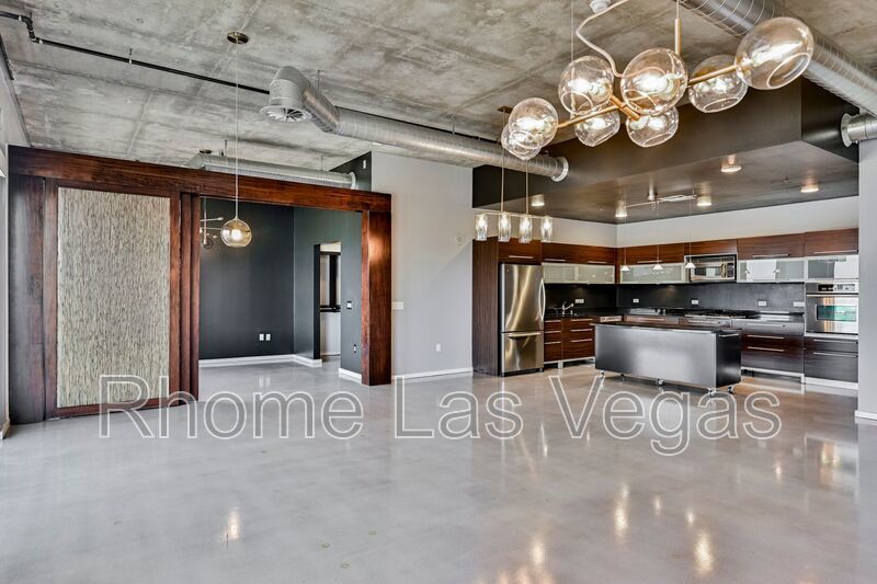 Modern Industrial Loft at Soho Lofts – 1BR/2BA High-Rise in the Arts District, City & Mountain Views! property image