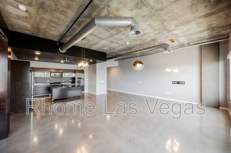 Modern Industrial Loft at Soho Lofts – 1BR/2BA High-Rise in the Arts District, City & Mountain Views! property image