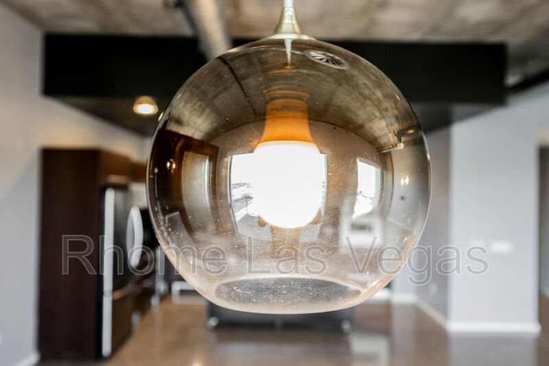 Modern Industrial Loft at Soho Lofts – 1BR/2BA High-Rise in the Arts District, City & Mountain Views! property image