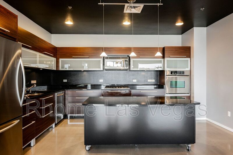 Modern Industrial Loft at Soho Lofts – 1BR/2BA High-Rise in the Arts District, City & Mountain Views! property image