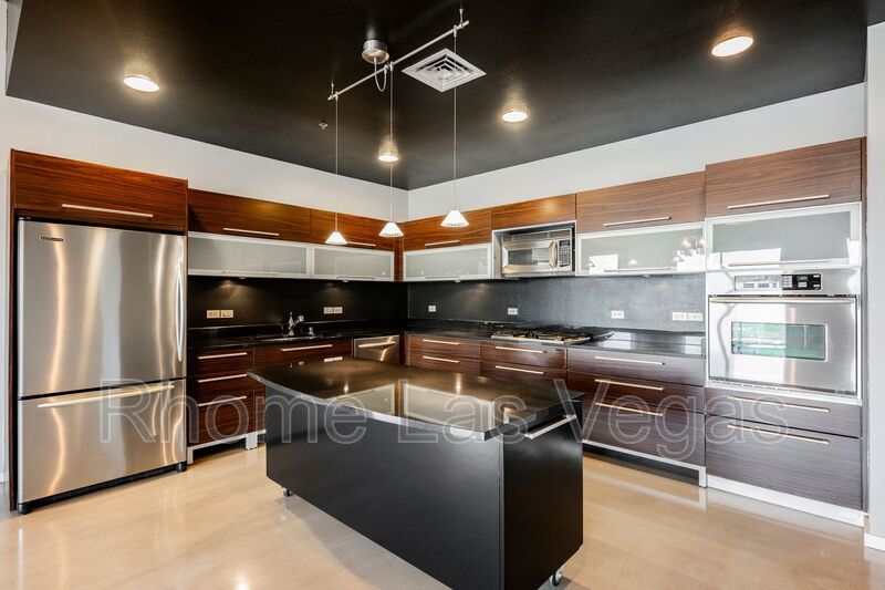 Modern Industrial Loft at Soho Lofts – 1BR/2BA High-Rise in the Arts District, City & Mountain Views! property image