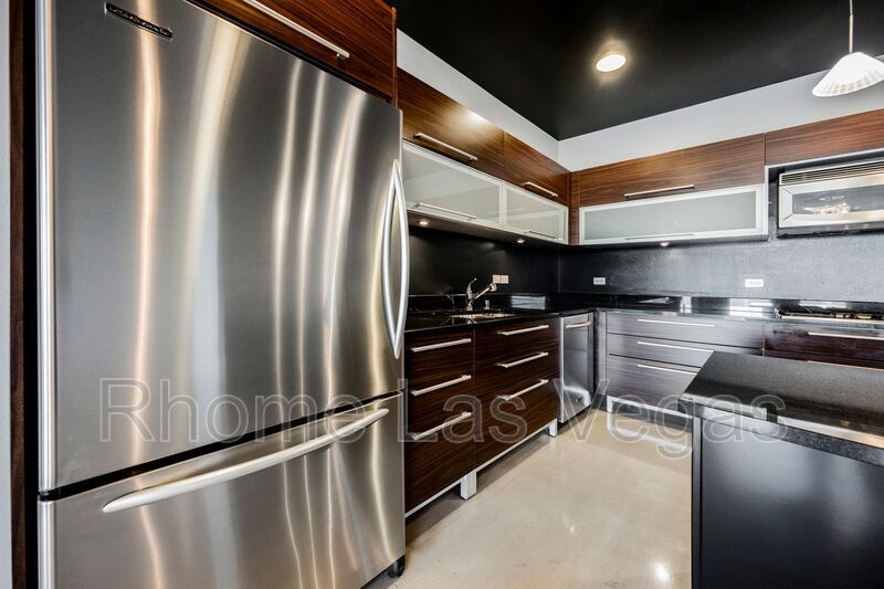 Modern Industrial Loft at Soho Lofts – 1BR/2BA High-Rise in the Arts District, City & Mountain Views! property image