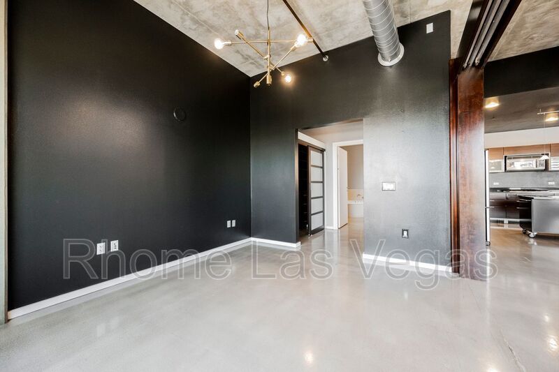 Modern Industrial Loft at Soho Lofts – 1BR/2BA High-Rise in the Arts District, City & Mountain Views! property image