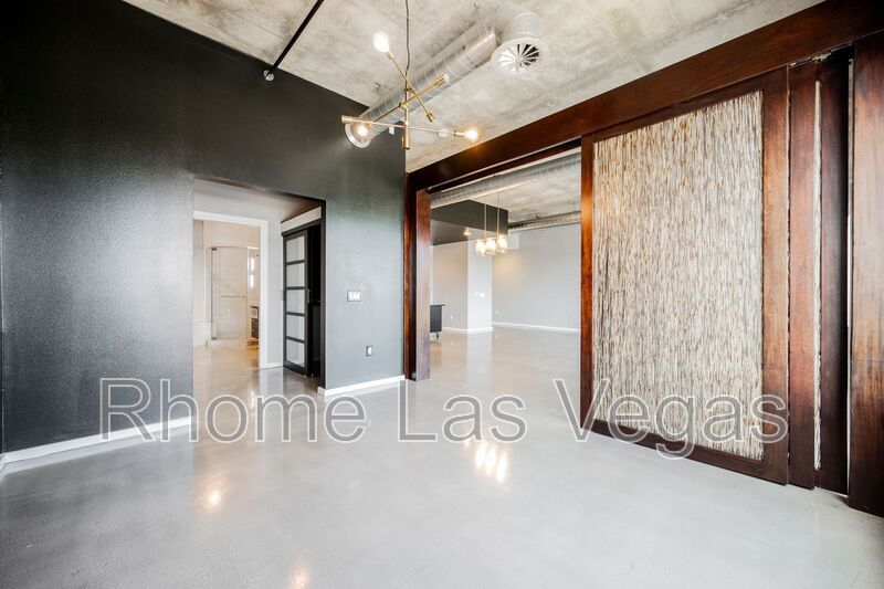 Modern Industrial Loft at Soho Lofts – 1BR/2BA High-Rise in the Arts District, City & Mountain Views! property image