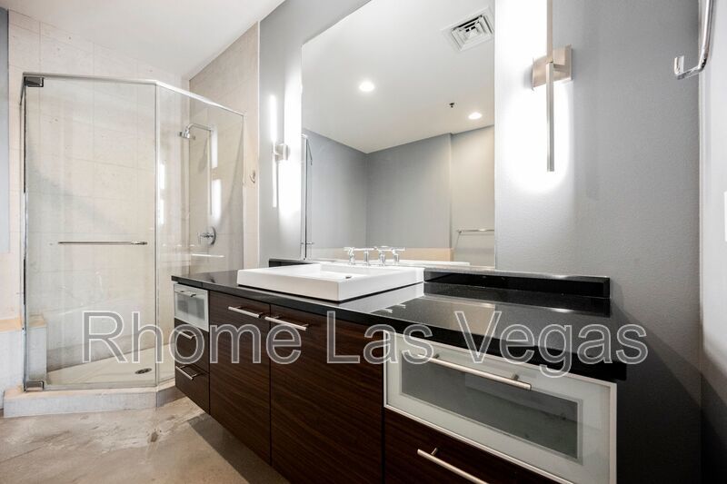 Modern Industrial Loft at Soho Lofts – 1BR/2BA High-Rise in the Arts District, City & Mountain Views! property image