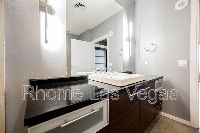 Modern Industrial Loft at Soho Lofts – 1BR/2BA High-Rise in the Arts District, City & Mountain Views! property image