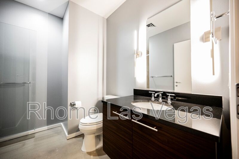 Modern Industrial Loft at Soho Lofts – 1BR/2BA High-Rise in the Arts District, City & Mountain Views! property image