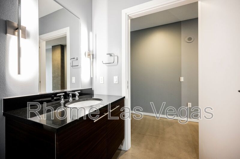 Modern Industrial Loft at Soho Lofts – 1BR/2BA High-Rise in the Arts District, City & Mountain Views! property image
