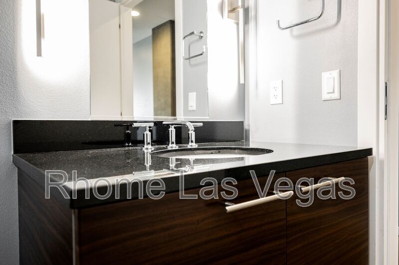 Modern Industrial Loft at Soho Lofts – 1BR/2BA High-Rise in the Arts District, City & Mountain Views! property image