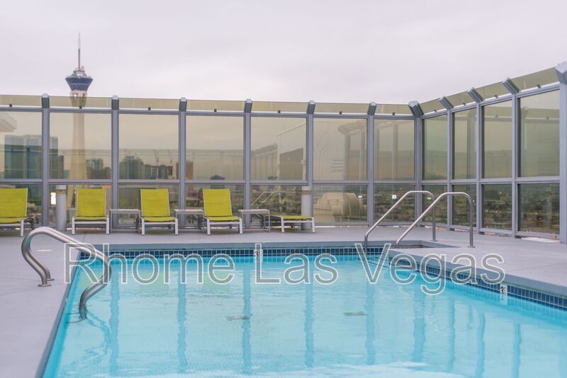 Modern Industrial Loft at Soho Lofts – 1BR/2BA High-Rise in the Arts District, City & Mountain Views! property image