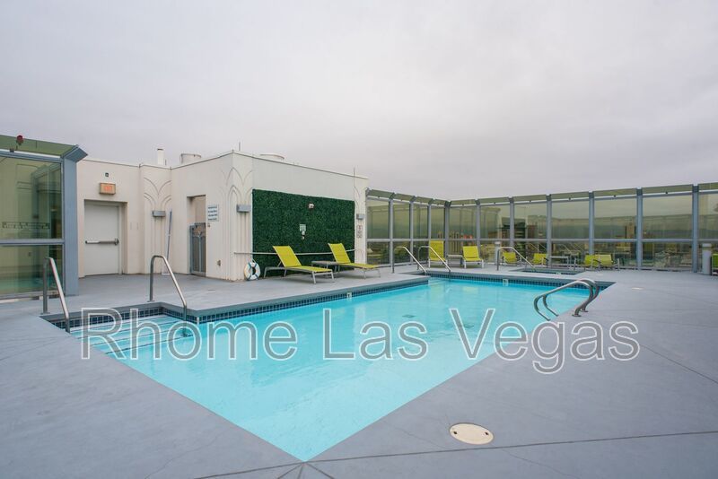 Modern Industrial Loft at Soho Lofts – 1BR/2BA High-Rise in the Arts District, City & Mountain Views! property image