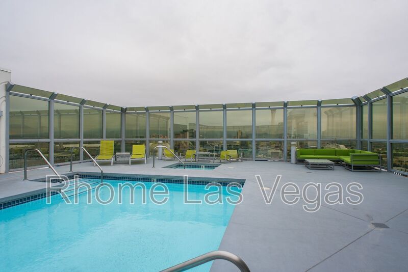 Modern Industrial Loft at Soho Lofts – 1BR/2BA High-Rise in the Arts District, City & Mountain Views! property image