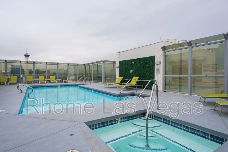 Modern Industrial Loft at Soho Lofts – 1BR/2BA High-Rise in the Arts District, City & Mountain Views! property image